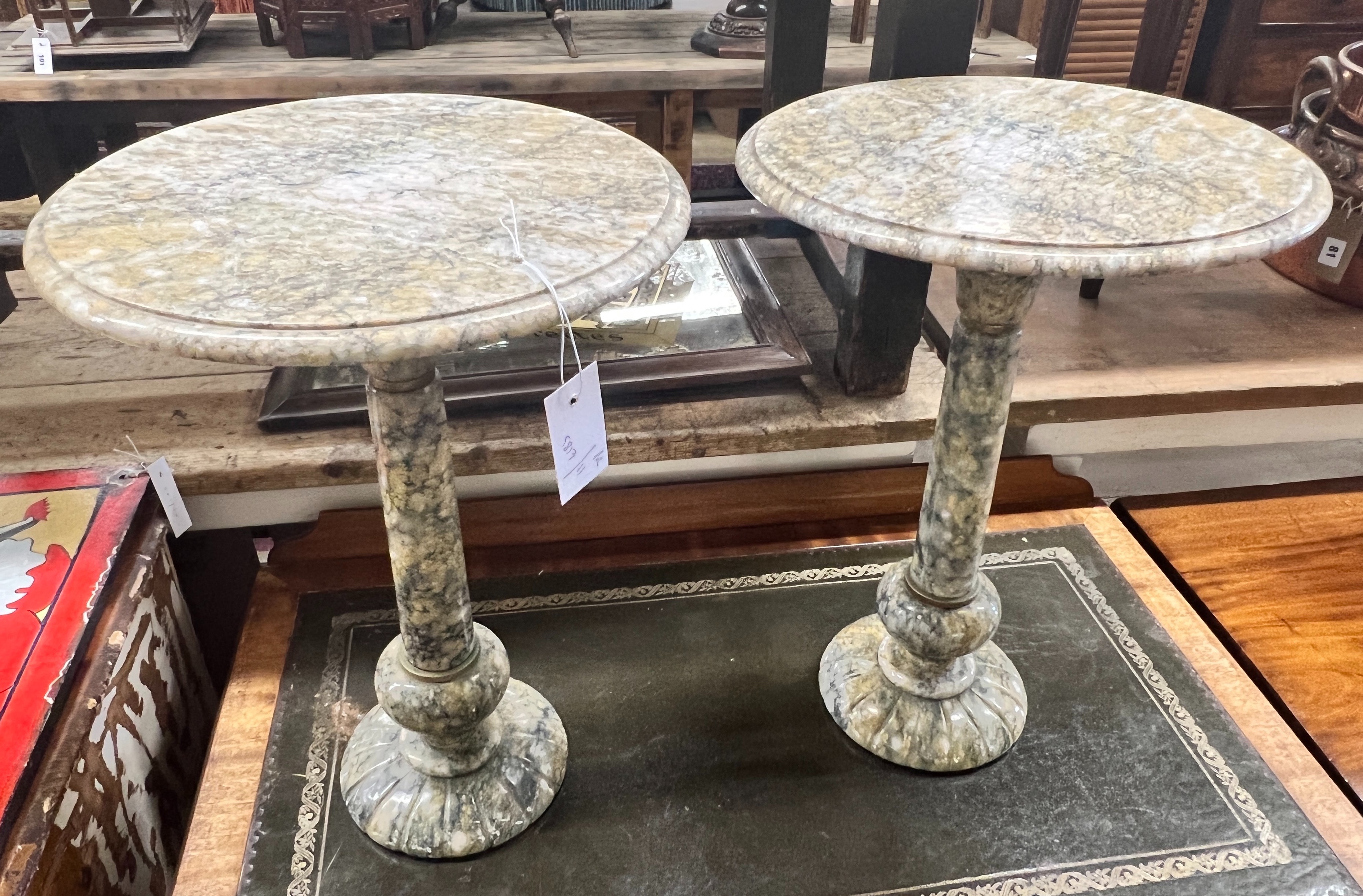 A pair of circular reconstituted marble wine tables, diameter 35cm, height 49cm